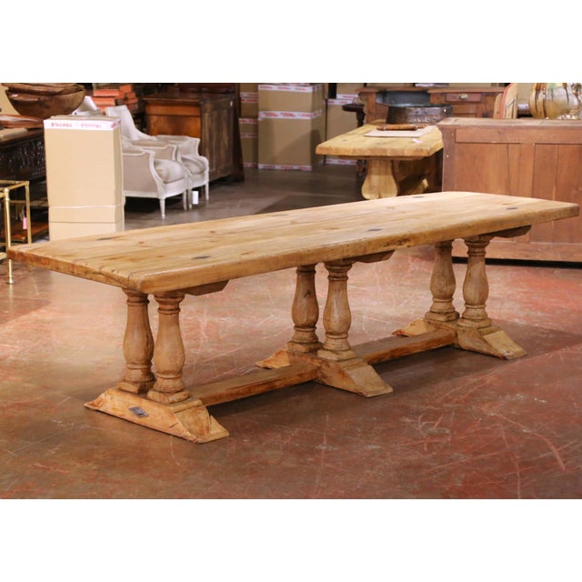 Crafted in France circa 1890, this substantial antique trestle dining table embodies the honest, utilitarian beauty of...