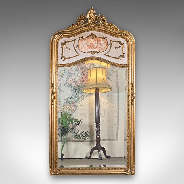 This is a large vintage pier mirror. A French, giltwood hall or lounge mirror in Louis XV revival taste, dating to the Art...