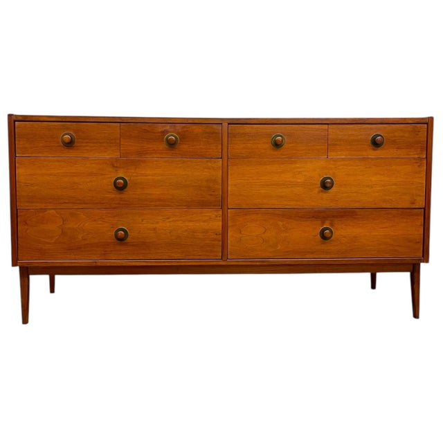 This Mid-Century Modern matching dresser set is attributed to John Van Koert for Drexel and reflects the clean-lined,...