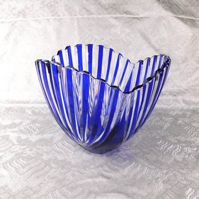 This is a large blue and clear art glass bowl. The bowl is not cut to clear, I believe the blue is applied to the clear...