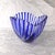 This is a large blue and clear art glass bowl. The bowl is not cut to clear, I believe the blue is applied to the clear...