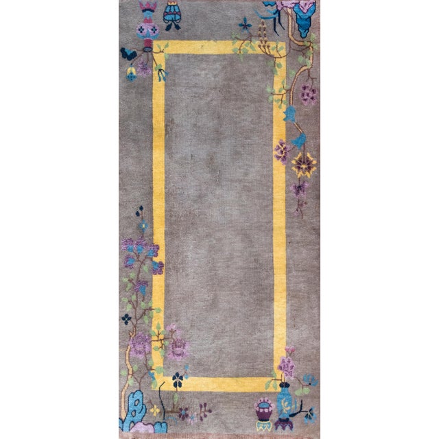 This early 20th-century Chinese Art Deco rug is a refined example of East meets West design, with a quiet palette and rich...