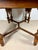 Handsome Spanish dining table crafted in wood, featuring turned baluster legs, carved details, and distinctive barley...