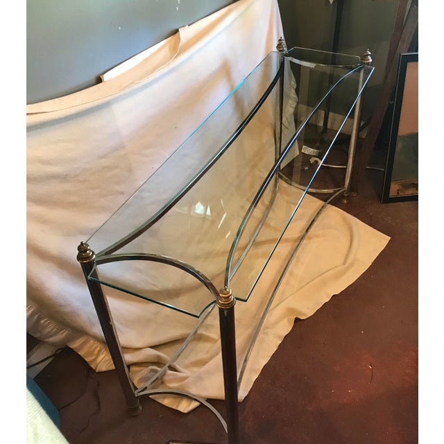 Mid-century console or sofa table, with chrome frame, brass finials and glass with contoured corners. Interesting bowed...