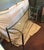 Mid-century console or sofa table, with chrome frame, brass finials and glass with contoured corners. Interesting bowed...
