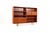 A stunning and highly functional Danish bookcase from the 1960s, crafted in warm teak veneer with a beautiful natural...