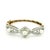 A graceful example of Victorian-era elegance, this antique bangle bracelet is crafted in 14K yellow gold with platinum-...