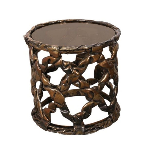 An exceptional pair of sculptural ribbon drum end tables designed by Tony Duquette, exemplifying his iconic Hollywood...
