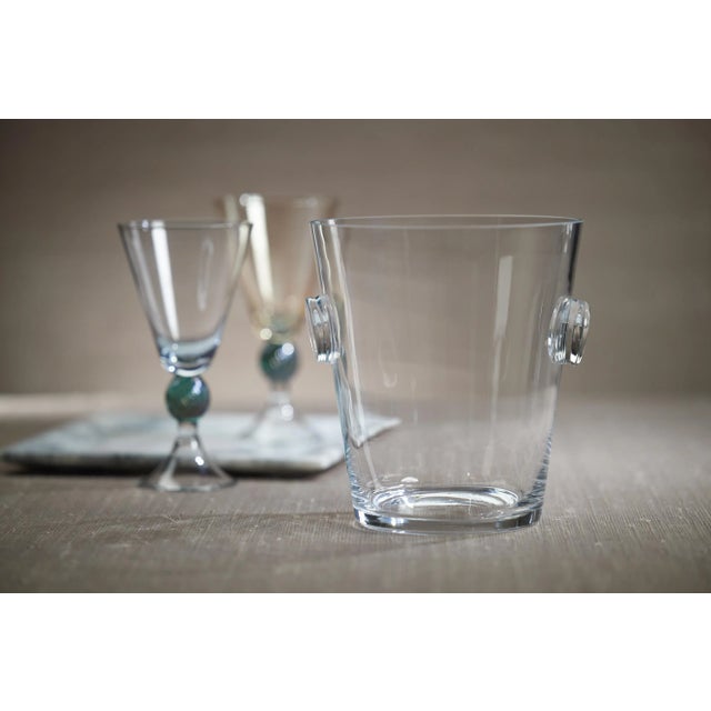 This ice bucket is easy to pick up and transport throughout your entire facility. While its integrated handles supply a...