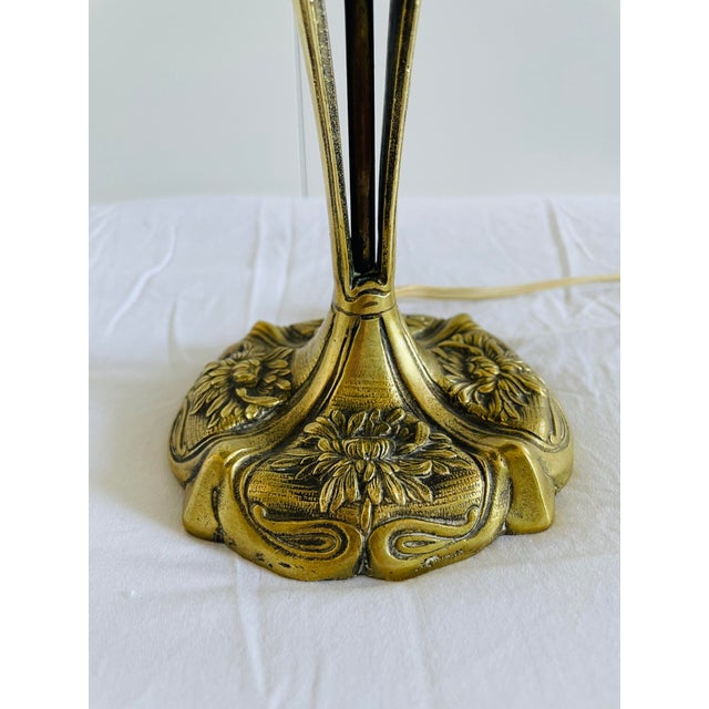 The beautiful lamp has a few signs of wear and could be rewired if necessary. The lamp requires French click bulbs. This...