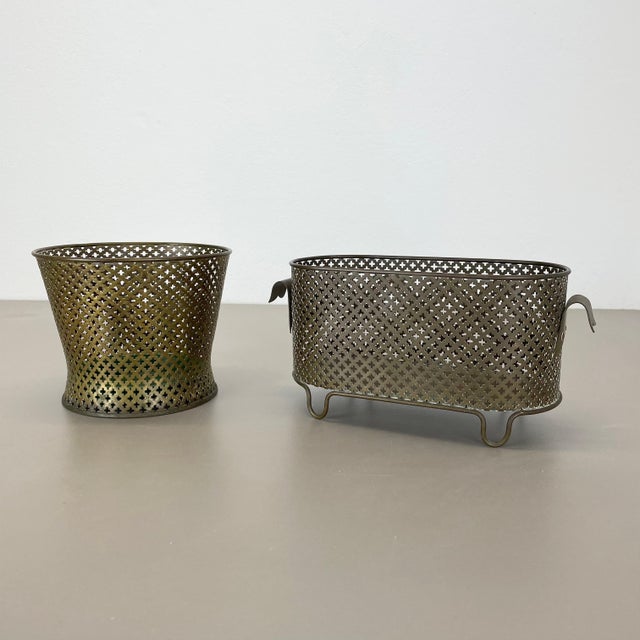 Article: Set of two modernist metal plant pots. Design: attributed to Mathieu Mategot Origin: France : This original set...