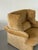 Vico Magistretti gave the Portovenere its signature trick in the 1980s: adjustable side headrests that let the wingback...