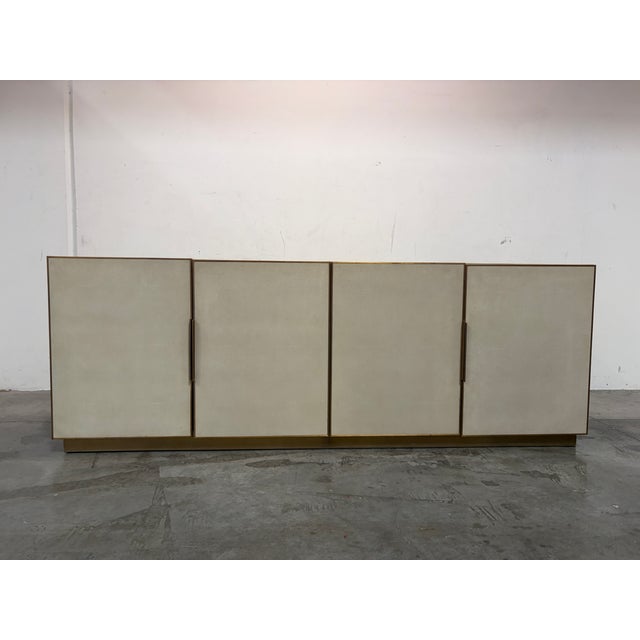 Exquisite RH Modern Cela Sideboard Buffet Crafted of leather and brass; the shagreen pattern is embossed into the leather...