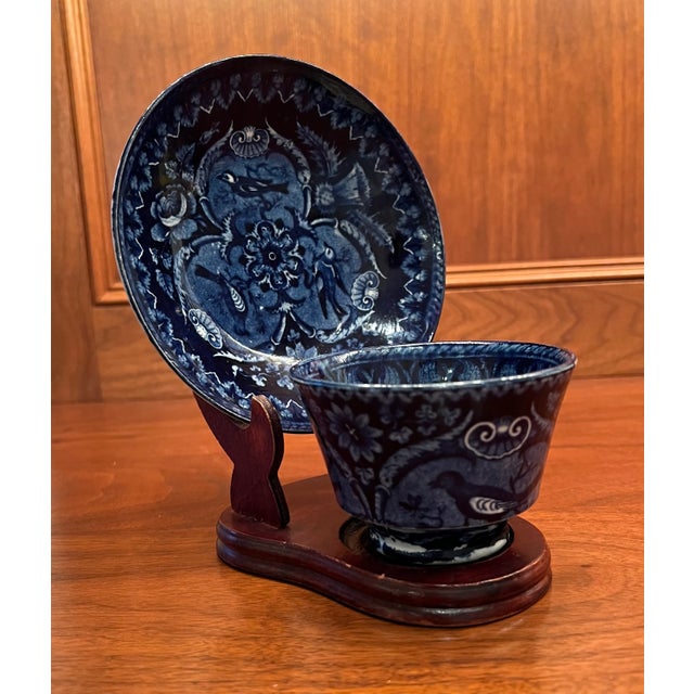 This deep blue Staffordshire cup and saucer is a beautiful accent piece for blue and white decor on shelves or in glass...