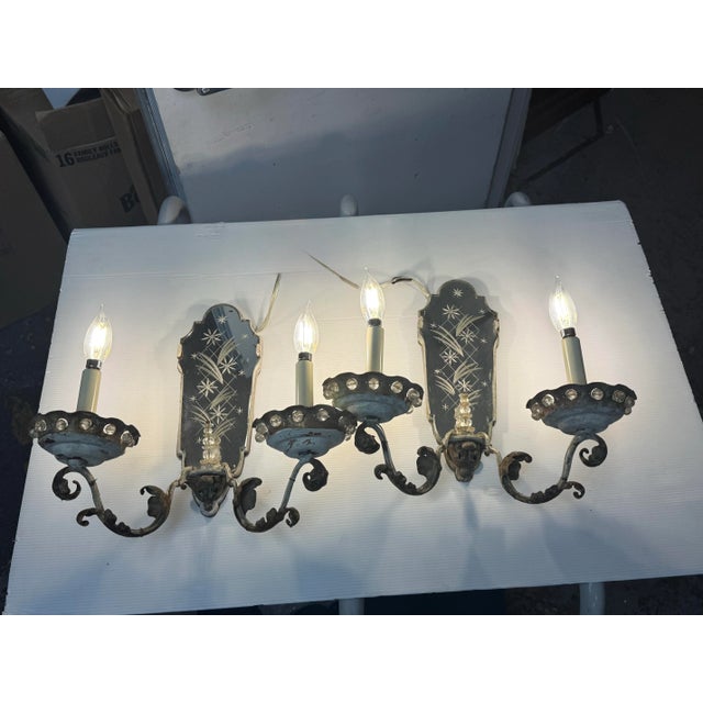 Design Plus Gallery presents a Pair of Etched Mirror Wall Sconces from the Early 20th Century, Likely 1920s. The sconces...