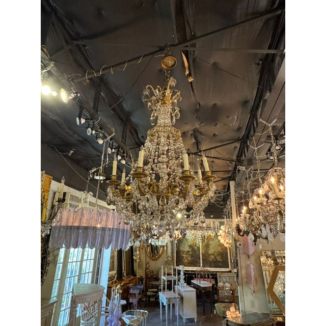 The 19th c. French Gilt Bronze and Crystal Chandelier is a luxurious and elegant lighting fixture that exudes old-world...