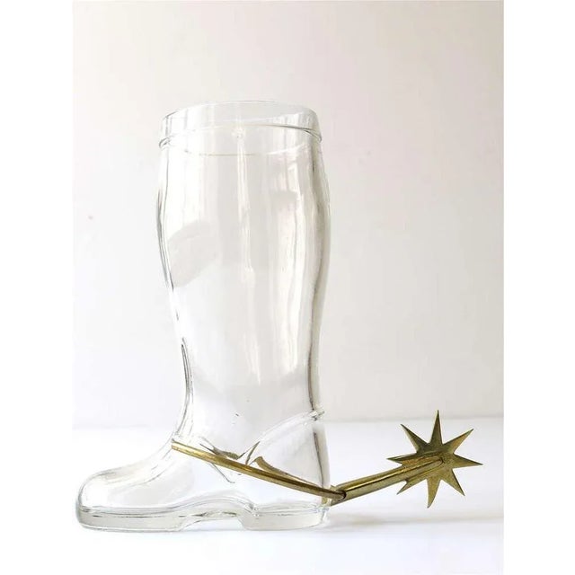 A very beautiful big drinking glass / pitcher in the shape of a boot with a nice brass spur. Designed and executed in the...