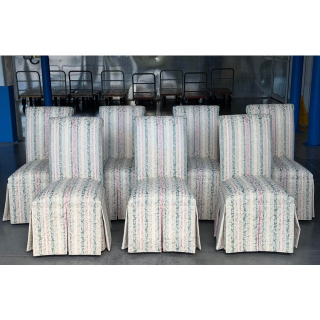 Set of seven vintage Designmaster Parsons-style skirted dining chairs, featuring clean architectural lines softened by...