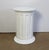 Large cylindrical and elegant pedestal, with a bright white, with large grooves inspired by the Roman columns of...