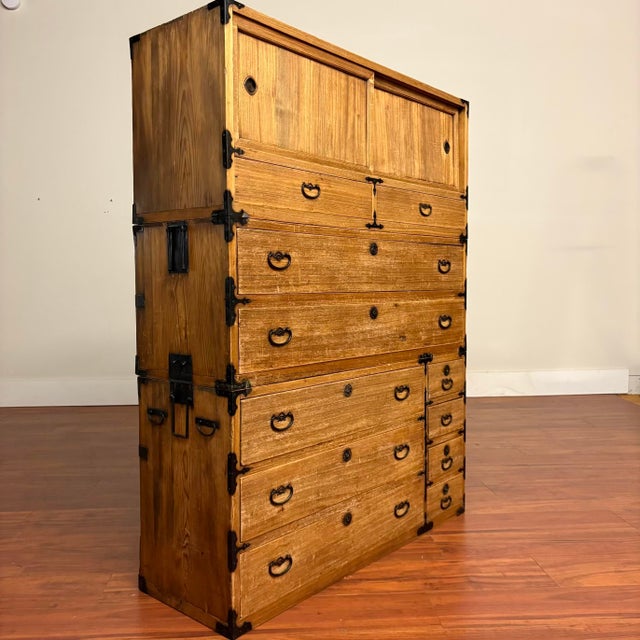 Antique Japanese three-section stacking tansu chest crafted from kiri (paulownia) wood with original hand-forged iron...