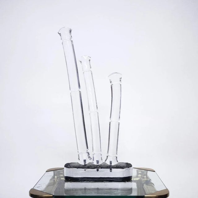 A sculpture of bamboo made from acrylic glass. This piece is attributed to the mentioned designer/maker. It has no...