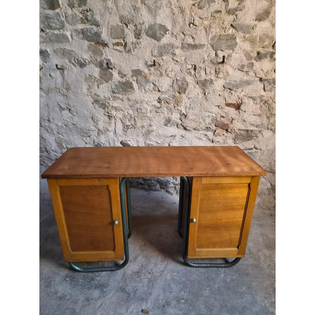 French Modernist writing desk dating from the 1930s, combining beechwood and plywood with a distinctive tubular steel...