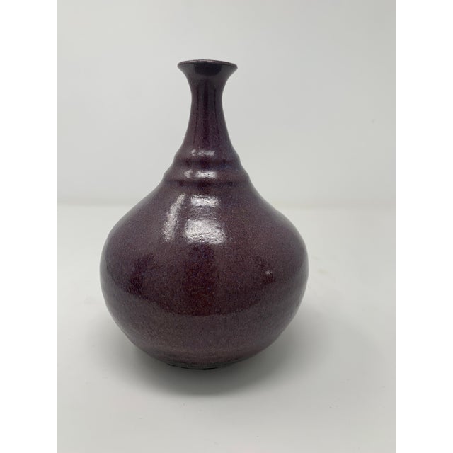 Beautiful purple/plum colored mid-century ceramic vase.
