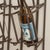 Metal wall shelf for nine wine bottles, with a semi-circular top and embossed grape motif. The open design combines...