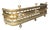 Regency brass fire fender. With three ball finials over a pierced body repeating spheres. Rope form lower edge and ball feet.