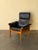 Beautiful vintage Swedish lounge armchair by Göte Möbler, featuring supple black leather upholstery paired with a solid...