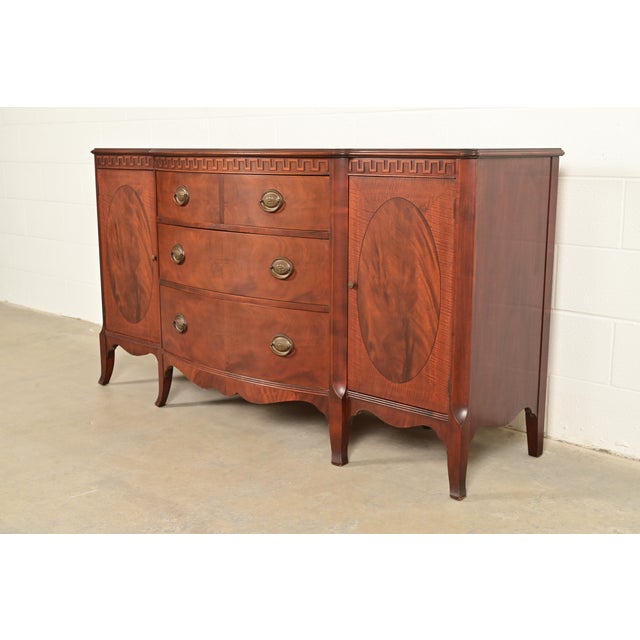 An exceptional Federal or Hepplewhite style sideboard, buffet, or credenza By Romweber USA, Circa 1920s Gorgeous inlaid...