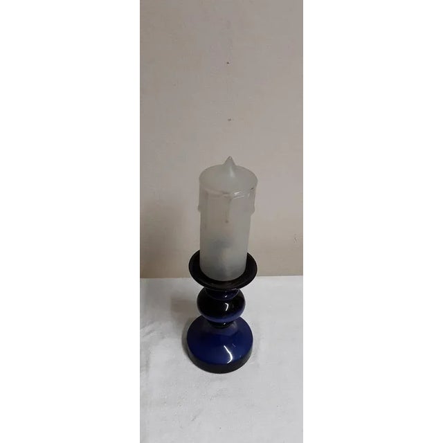 vintage table lamp from the 70s in candlestick look with a blue ceramic base and a glass shade in the shape of a candle...