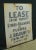 Reclaimed movie set sign made of aluminum in black and white. The sign reads "To Lease Entire Property, Stores -...