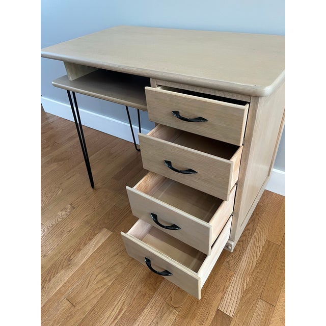This MCM oak desk with hairpin legs has been carefully restored in our shop. The finish is a subtle paint wash with...
