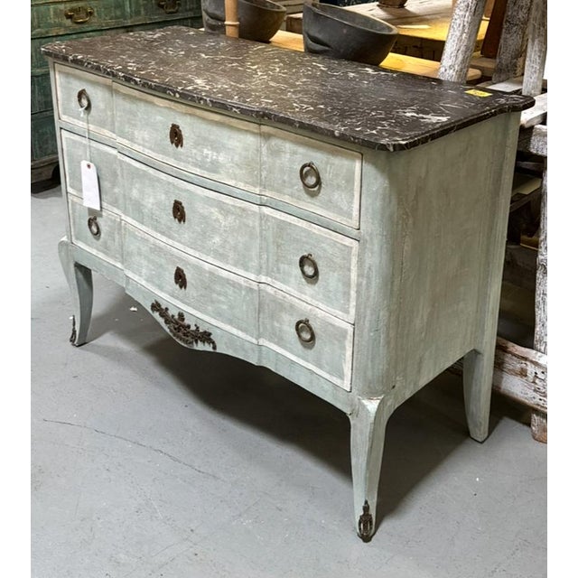 1900’s period French chest of drawers or commode with brass hardware and original marble top. Mix of beautiful soft blue,...