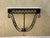This elegant vintage scrolled iron wall console is crafted in the style of Jean Royère, capturing the sculptural...