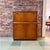 Vintage mid-century modern teak drop-front cocktail cabinet manufactured by Turnidge of London. Perfect for use as a...