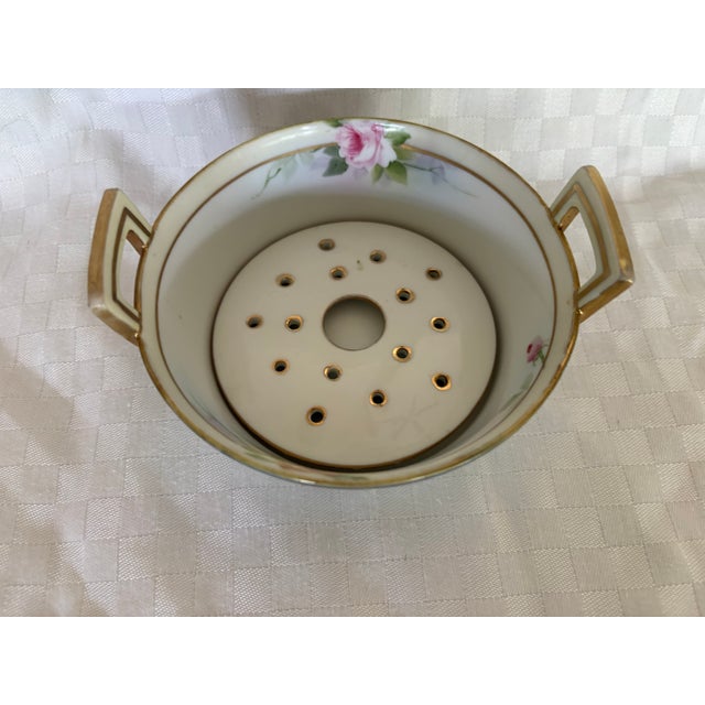 This double handled butter tub has an interior drain. The piece is early 20th C porcelain from the Nippon or Meiji/Taisho...