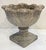 A finely modeled and weathered English garden planter pot or urn of composition stone featuring a beautiful acanthus leaf...