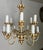 Italian 12 light 1930's Italian Rococo-style chandelier. It features a cream painted finish with gold leaf accents. The...
