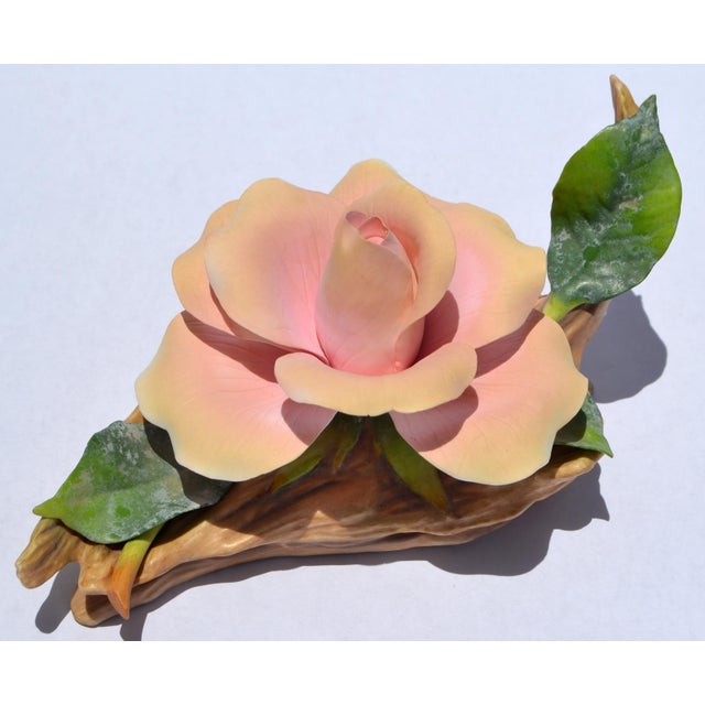 Edward Marshall Boehm American Express Rose ceramic piece is a finely crafted porcelain creation, celebrated for their...