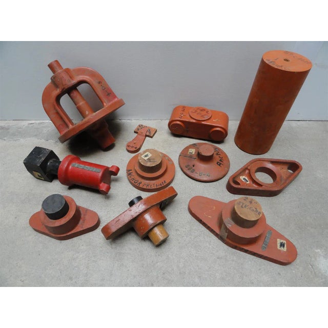A remarkable collection of eleven vintage industrial wood foundry patterns, each possessing its own unique form,...
