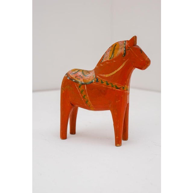 An authentic hand-carved Dala horse by Nils Olsson, produced in the 1920s in the village of Nusnäs, the historic center of...