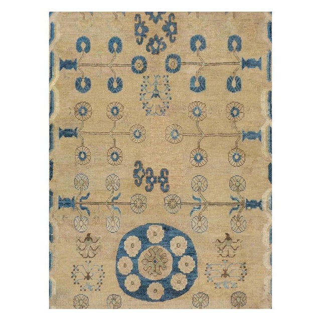 An antique East Turkestan Khotan gallery format carpet handmade during the turn of the 20th century. Measures: 7' 2" x 12'...