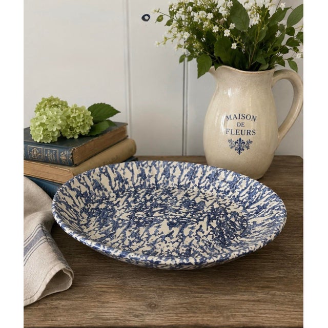 Bring timeless European charm to your table with this vintage Italian hand-decorated spongeware serving platter. Crafted...
