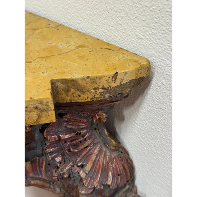 A truly beautiful Italian carved console with a Siena marble top. It dates from the 18th century although it has undergone...