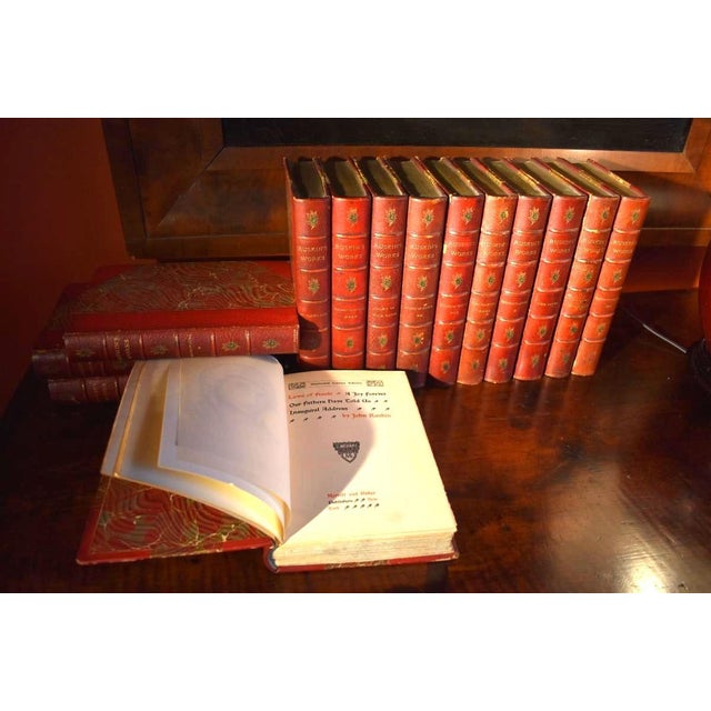 A lovely group of 14 books of John Ruskin's works, quarter bound in red leather with gilt embossing. All published in late...