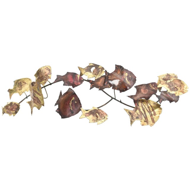 Mid-Century Modern copper and brass school of 15 fish wall sculpture. The Brutalist design is in the style of Curtis Jere....