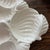 Beautiful vintage ceramic serving platter made in Italy, featuring an intricate raised seashell and coastal motif....