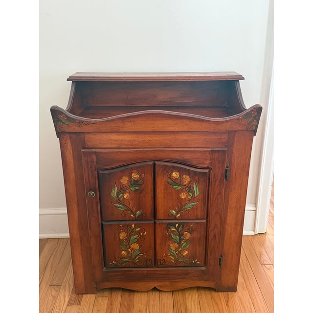 A sturdy midcentury pine dry sink or bar cabinet. Beautifully hand-painted in 1982. So many possible uses in the kitchen,...